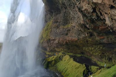 Scenic view of seljalandsfoss by mountains