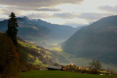 Scenic view of mountains against sky at sunset