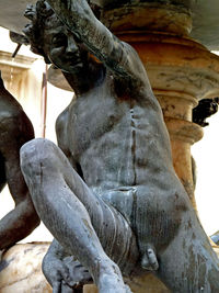 Low angle view of statue against sky