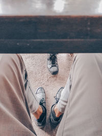 Low section of man standing on floor