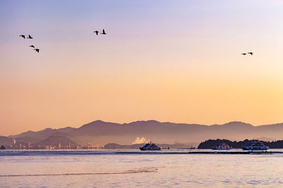 Scenic view of sea against sky during sunset