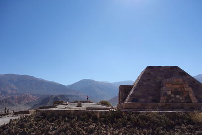 View of buildings against mountain range