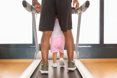 Low section of man exercising in gym