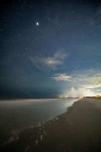 Scenic view of sea against sky at night