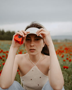 Young woman holding flower
