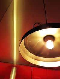 Low angle view of illuminated electric lamp