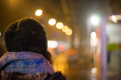 Rear view of man in illuminated hat