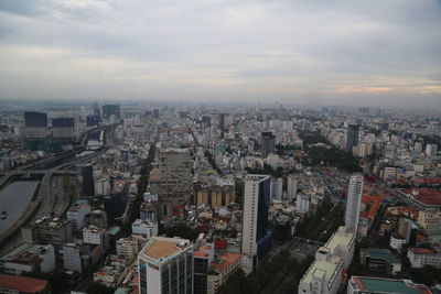 High angle view of buildings in city against sky