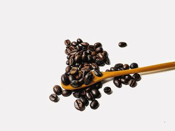 Close-up of coffee beans against white background