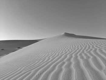 Scenic view of desert against clear sky