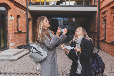 Young woman using mobile phone