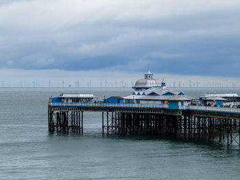 Pier over sea against sky