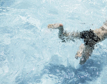 Man swimming in pool