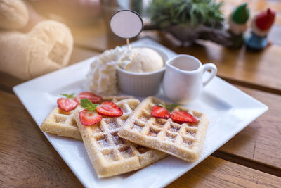 Close-up of breakfast served on table