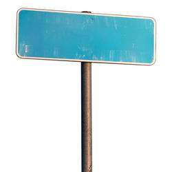 Close-up of road sign against white background