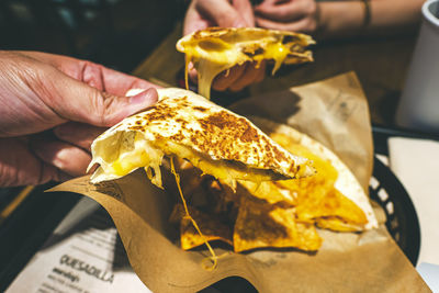 Close-up of hand holding ice cream