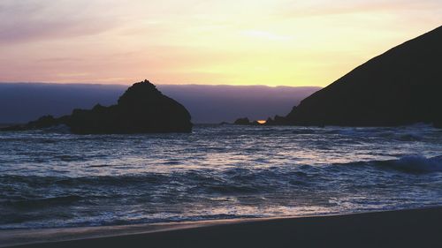 Scenic view of sea at sunset