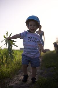 Boy standing on field