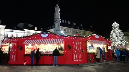 Illuminated people at night