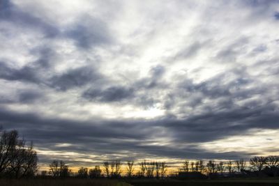 Scenic view of landscape against cloudy sky