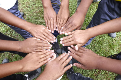 Midsection of people showing hands