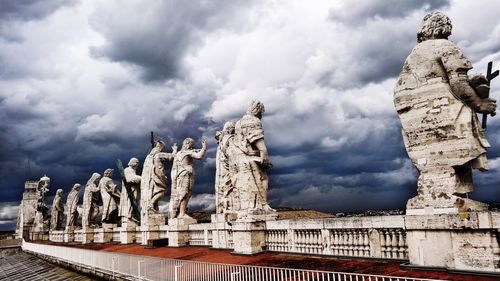 Low angle view of historical building against cloudy sky