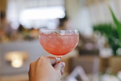 Close-up of hand holding wineglass