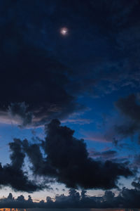 Low angle view of moon in sky at night