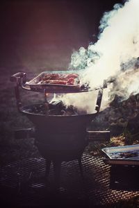 High angle view of meat on barbecue grill