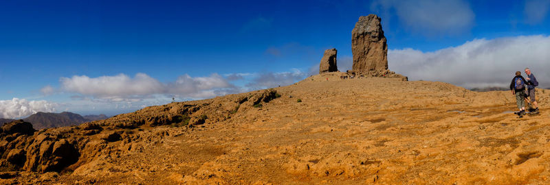 Panoramic view of rock formations against sky