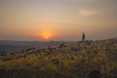 Scenic view of landscape against sky during sunset