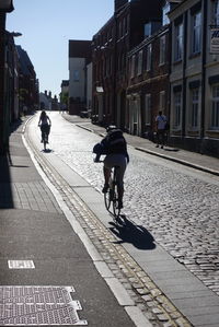 People walking on street in city