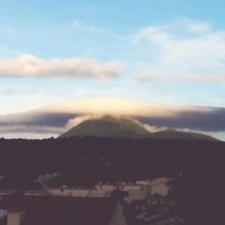 Scenic view of mountains against sky at sunset