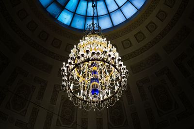 Low angle view of chandelier hanging from ceiling