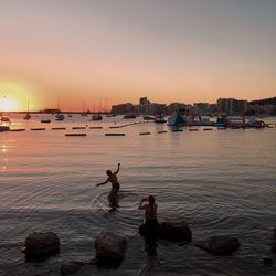 Scenic view of sea against clear sky during sunset