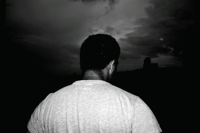 Rear view of man standing against sky