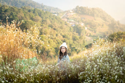 Portrait of young woman in park