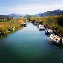 High angle view of boats moored in lake against sky