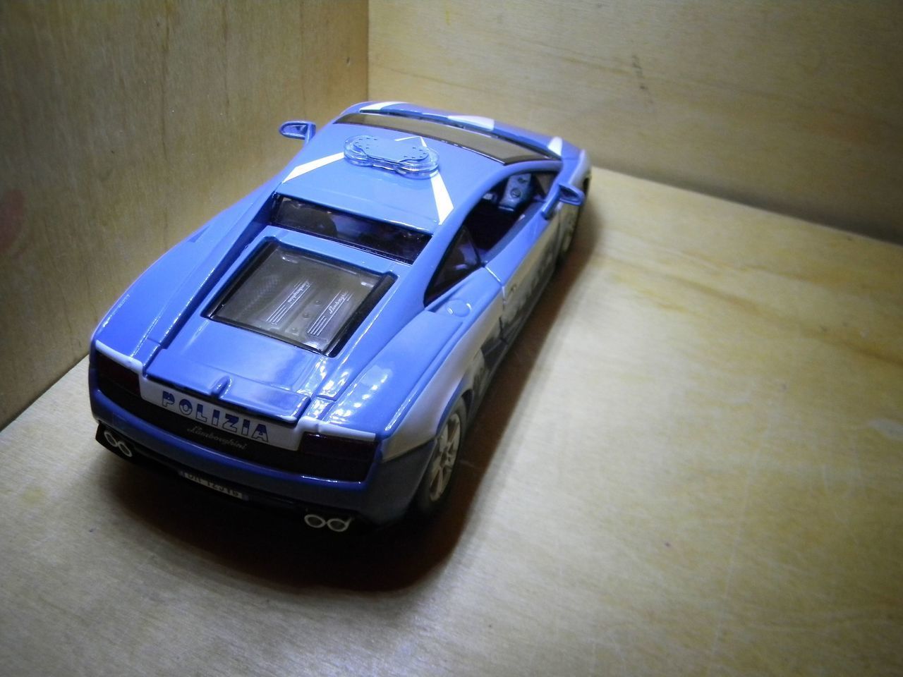 HIGH ANGLE VIEW OF TOY CAR ON TABLE AT HOME