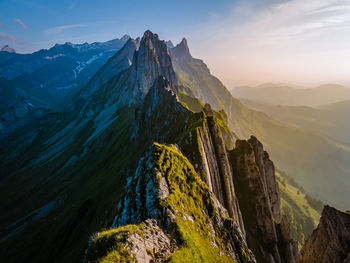 Scenic view of mountains against sky during sunset