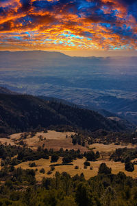 Scenic view of landscape against sky during sunset