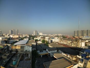 High angle view of buildings in city against clear sky