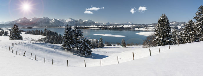 Scenic view of snow covered mountains against sky