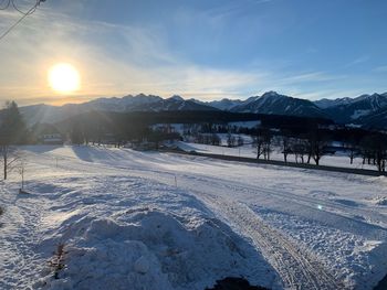 Scenic view of snow covered mountains against sky