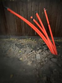 Red umbrella against wall in yard