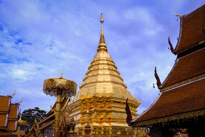 Low angle view of pagoda against buildings