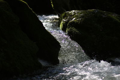 Close-up of man splashing water