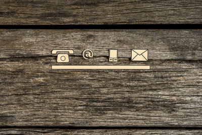 Close-up of text on wooden plank