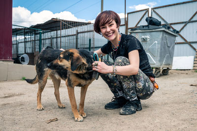 Dog at the shelter. animal shelter volunteer feeding the dogs.  