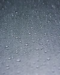 Full frame shot of raindrops on rainy day
